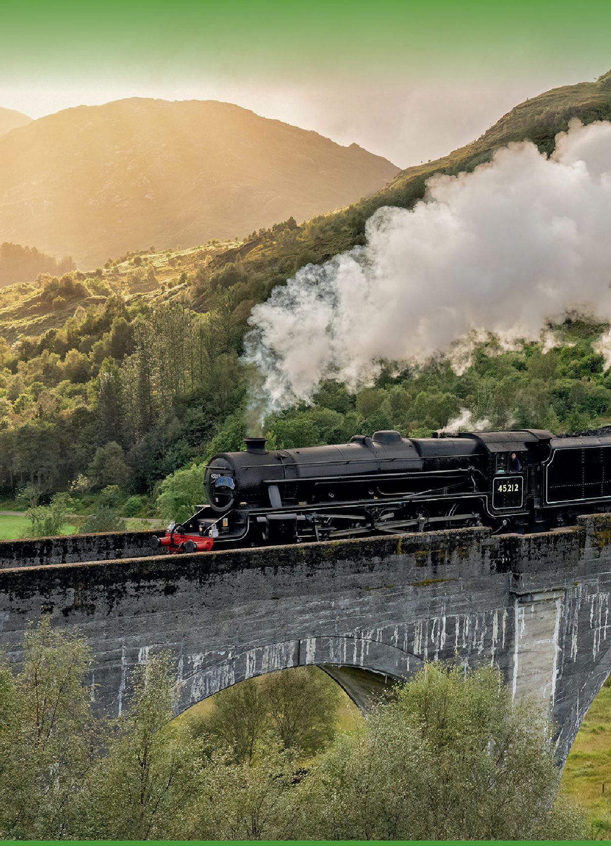 A steam train crossing the Glenfinnan Viaduct in the Scottish Highlands