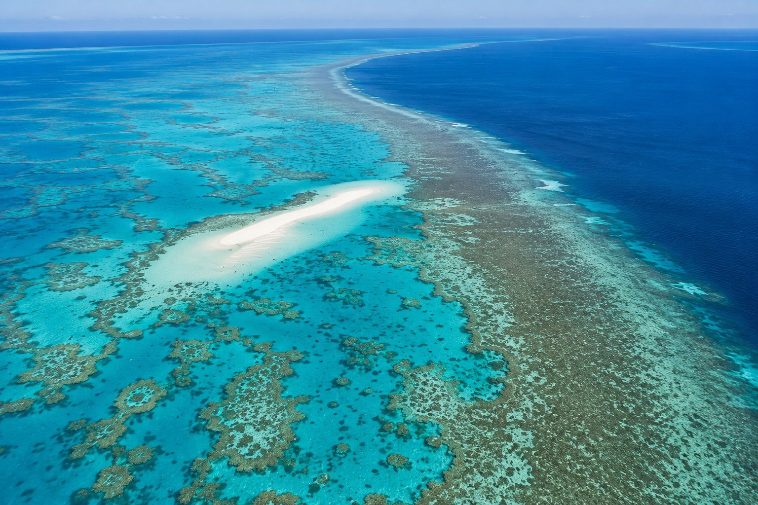 The turquoise reef and sandbank from the air