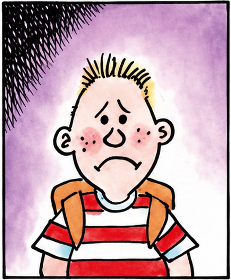 Boy with freckles wearing a backpack