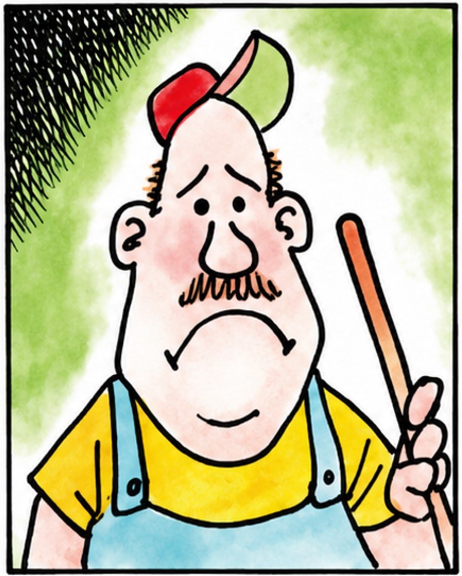 Man in overalls and a cap holding a broom